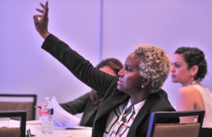 A Summit Attendee Raises her hand