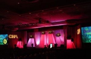 Stage towers lit in Pink and purple
